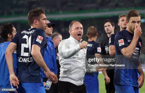 Head coach Torsten Lieberknecht of Braunschweig reacts next to Patrick Schoenfeld and Ken Reichel of Braunschweig after the Bundesliga Playoff first...