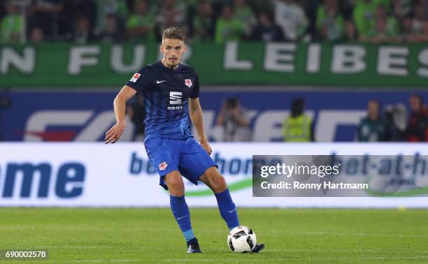 Gustav Valsvik of Braunschweig runs with the ball during the Bundesliga Playoff first leg match between VfL Wolfsburg and Eintracht Braunschweig at...