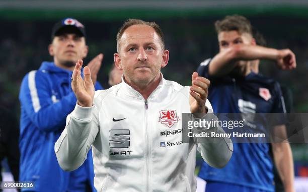 Head coach Torsten Lieberknecht of Braunschweig applauds the supporters after the Bundesliga Playoff first leg match between VfL Wolfsburg and...
