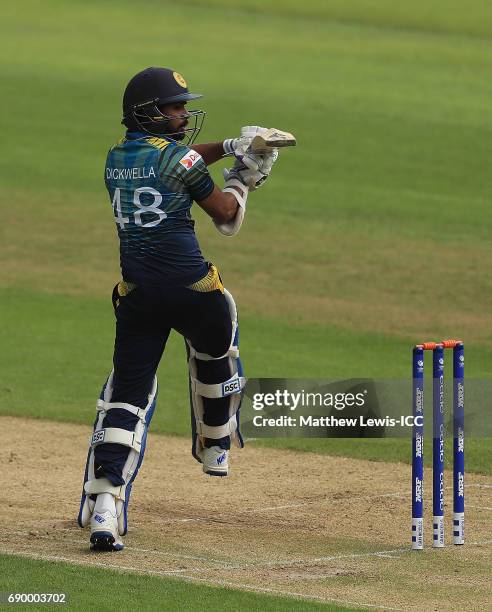 Niroshan Dickwella of Sri Lanka pulls the ball towards the boundary during the ICC Champions Trophy Warm-up match between New Zealand and Sri Lanka...