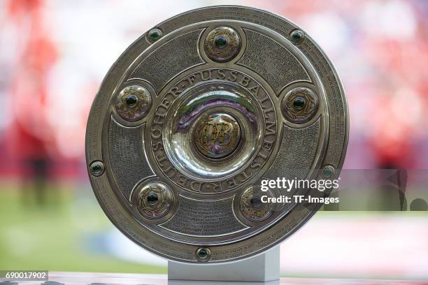 The German Championship trophy is displayed prior the Bundesliga match between Bayern Muenchen and SC Freiburg at Allianz Arena on May 20, 2017 in...