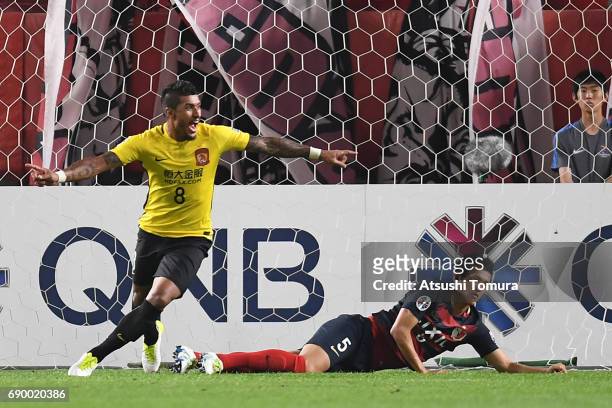Paulinho of Guangzhou Evergrande celebrates after scoring a goal during the AFC Champions League Round of 16 match between Kashima Antlers and...