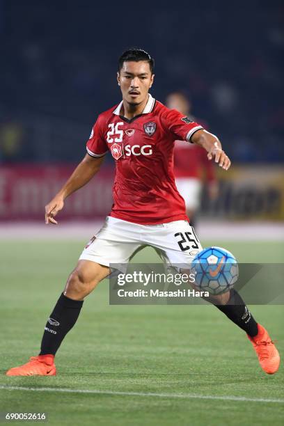 Adison Promrak of Muangthong United in action during the AFC Champions League Round of 16 match between Kawasaki Frontale and Muangthong United at...