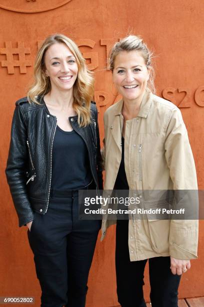 Journalist Laurie Delhostal and Astrid Bard attend the 2017 French Tennis Open - Day Three at Roland Garros on May 30, 2017 in Paris, France.