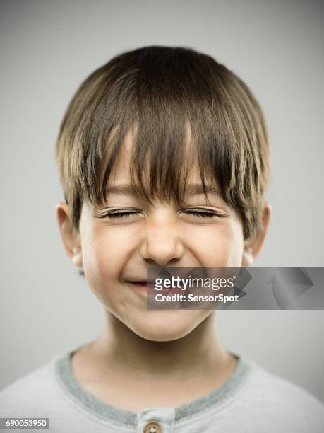 cute little boy closing eyes and smiling - child eyes closed stock pictures, royalty-free photos & images