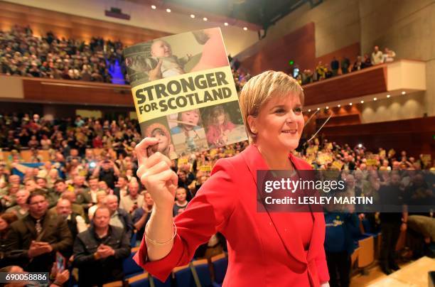 Scottish First Minister and Leader of the SNP, Nicola Sturgeon, poses for a photograph after unveiling the Scottish National Party's election...