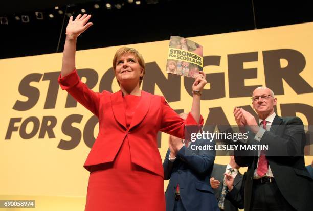 Scottish First Minister and Leader of the SNP, Nicola Sturgeon, poses for a photograph after unveiling the Scottish National Party's election...