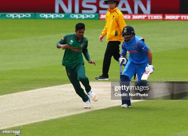 Mustafizur Rahman of Bangladesh and Shikhar Dhawan of India during the ICC Champions Trophy Warm-up match between India and Bangladesh at The Oval in...