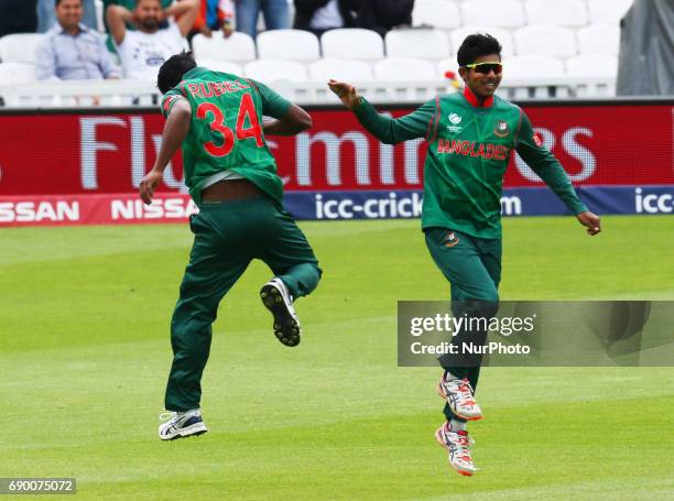 Rubel Hossain of Bangladesh celebrates with Musaddek Hossain Rahman of Bangladesh bolwing out Rohit Shama of India during the ICC Champions Trophy...