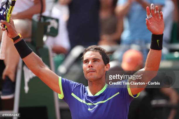 French Open Tennis Tournament - Day Two. Rafael Nadal of Spain celebrates his victory against Benoit Paire of France on Court Suzanne-Lenglen during...