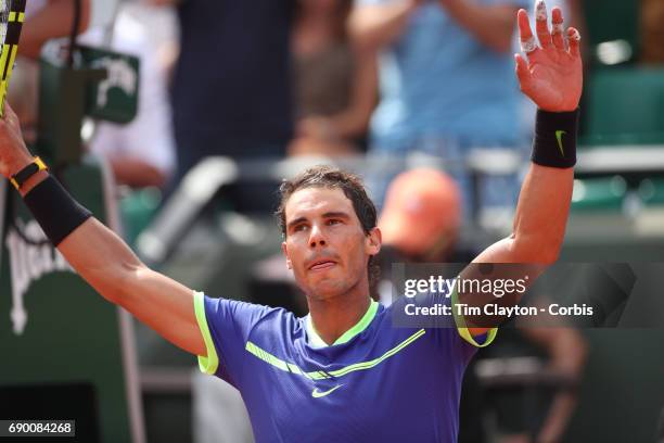 French Open Tennis Tournament - Day Two. Rafael Nadal of Spain celebrates his victory against Benoit Paire of France on Court Suzanne-Lenglen during...