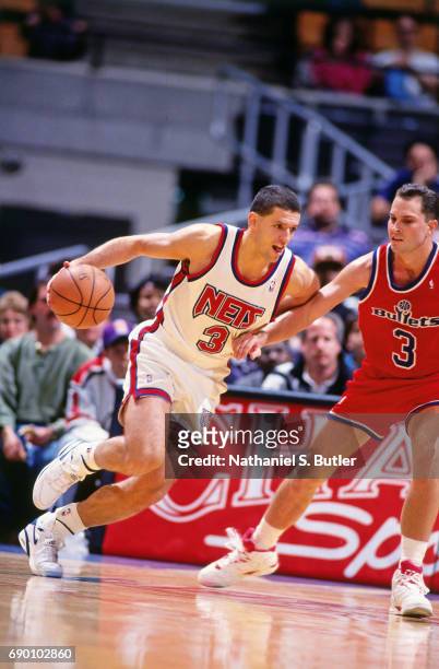 Drazen Petrovic of the New Jersey Nets drives to the basket during the game against the Washington Bullets circa 1993 at the Brendan Byrne Arena in...
