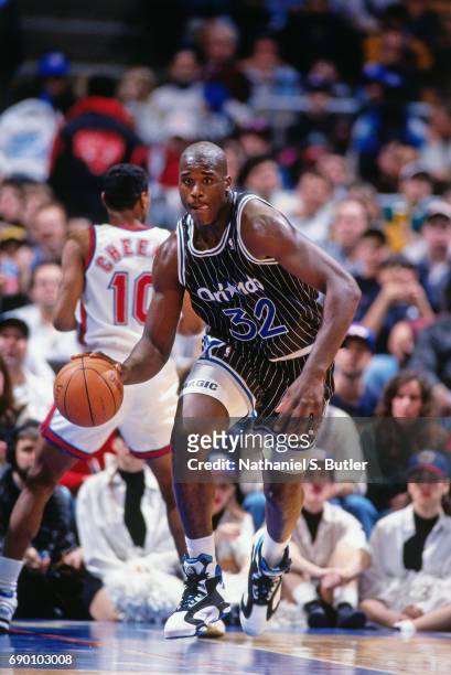 Shaquille O'Neal of the Orlando Magic brings the ball up court during the game against the New Jersey Nets circa 1993 at the Brendan Byrne Arena in...