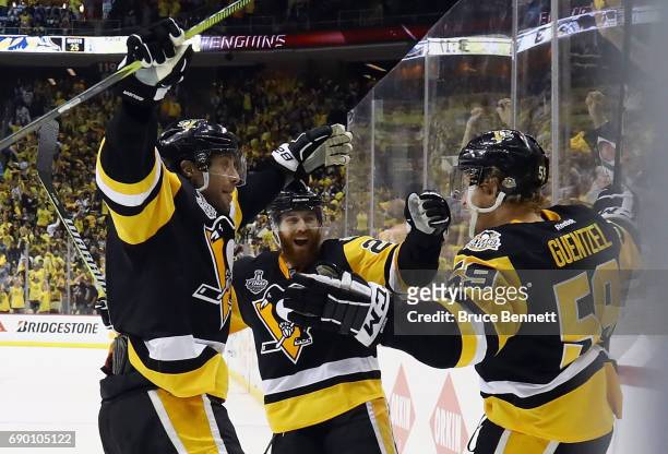 Jake Guentzel of the Pittsburgh Penguins reacts after scoring a goal during the third period in Game One of the 2017 NHL Stanley Cup Final against...