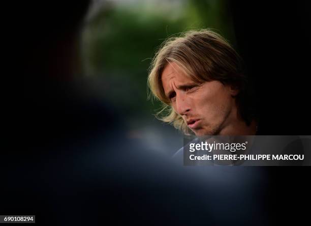 Real Madrid's Croatian midfielder Luka Modric attends an interview in the mixed zone at Valdebebas Sport City in Madrid on May 30, 2017 at the Media...