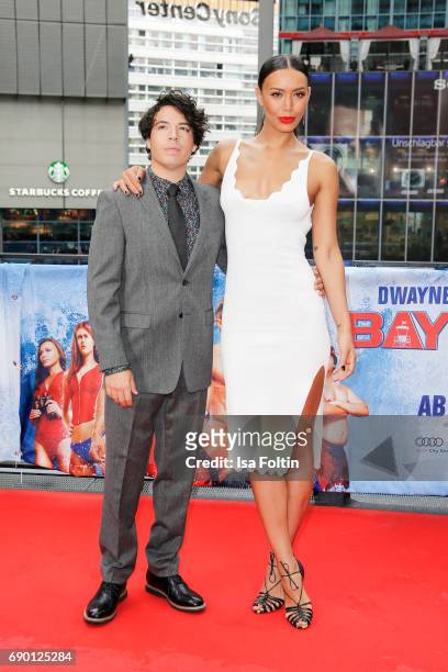 Actor Jon Bass and US actress Ilfenesh Hadera attend the 'Baywatch' Photo Call in Berlin on May 30, 2017 in Berlin, Germany.