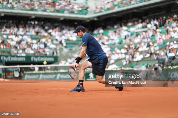 Andy Murray of Great Britain plays a backhand during his match with Andrey Kuznetsov of Russia during Day Three at Roland Garros on May 30, 2017 in...