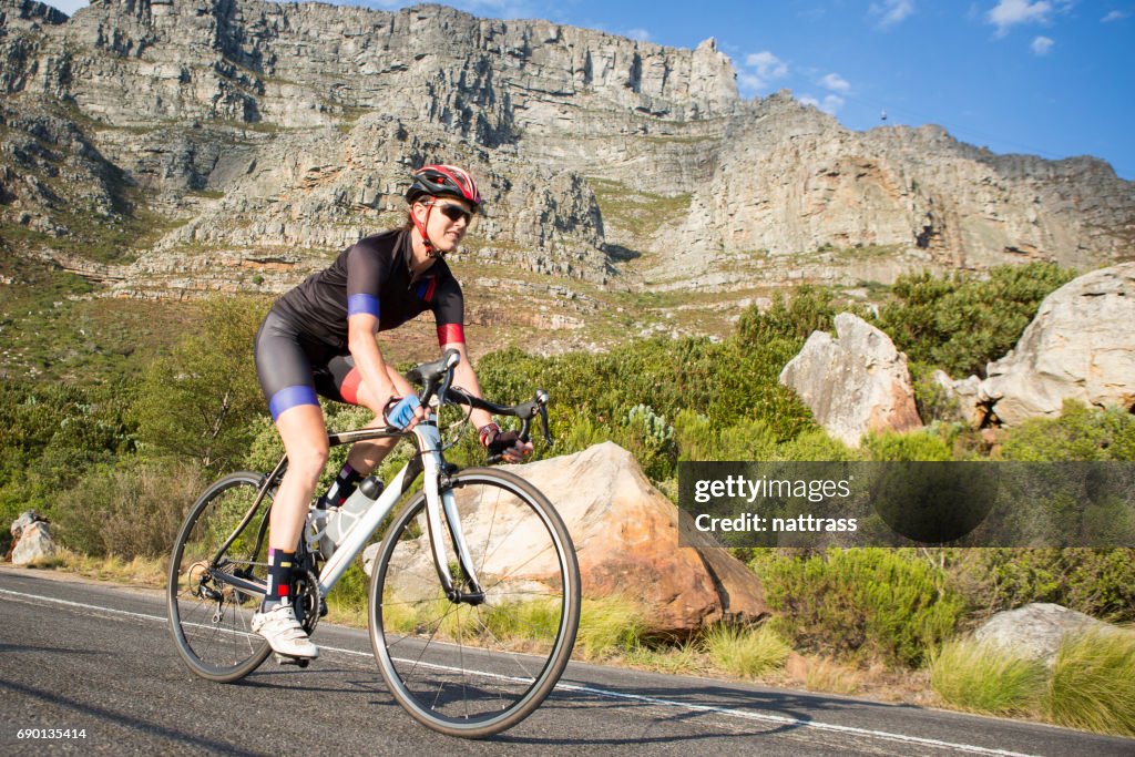 Female cyclist out on a training ride on her road bike