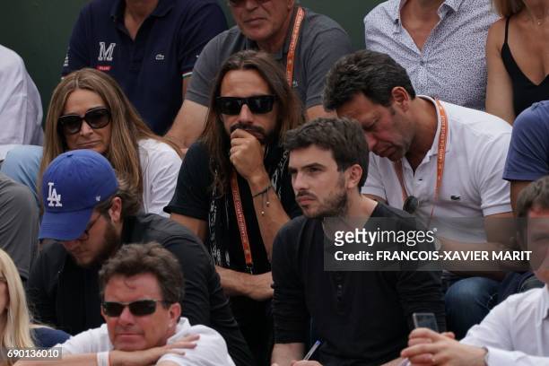 French Disc Jockey Christophe Le Friant aka Bob Sinclar attends a tennis match during the Roland Garros 2017 French Open on May 30, 2017 in Paris. /...