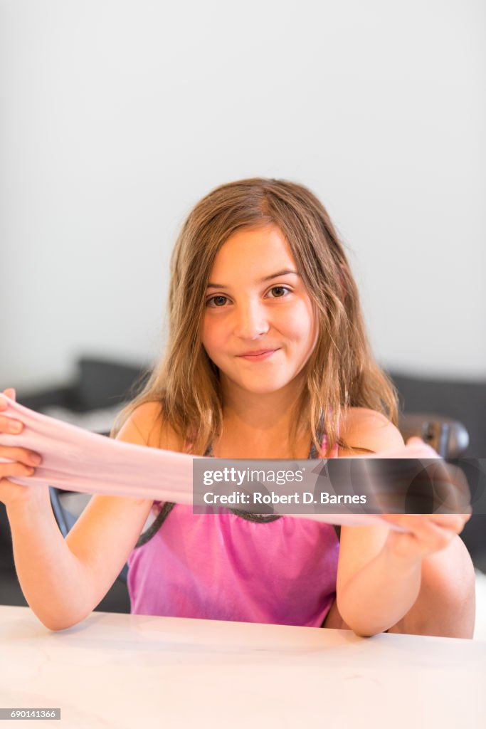 Girl playing with Homemade Slime