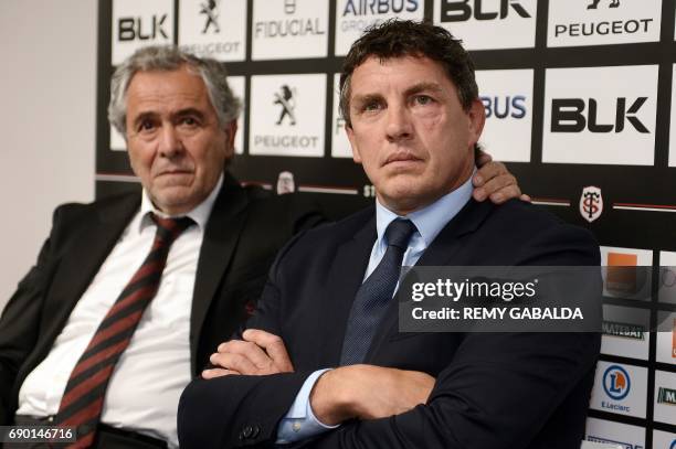 Stade Toulousain Rugby club president Jean Rene Bouscatel and former Toulouse player Didier Lacroix look on during a press conference announcing...