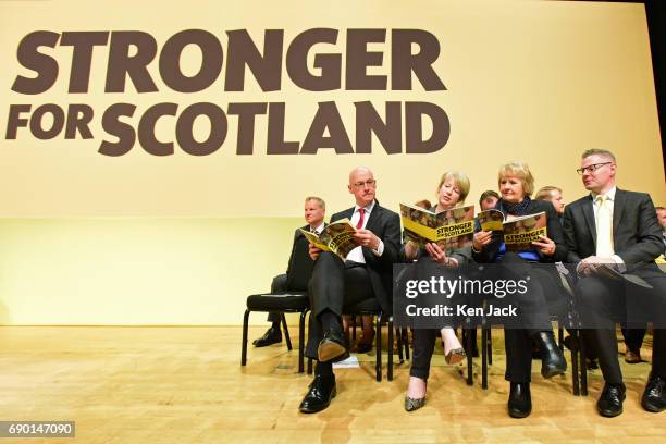 Scottish Government ministers study the SNP general election manifesto at its launch, which was delayed for a week in the aftermath of the Manchester...