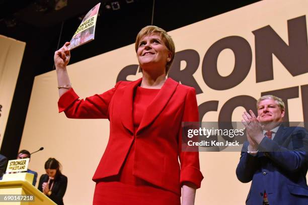Leader Nicola Sturgeon is applauded by Depute Leader Angus Robertson as she launches the SNP general election manifesto, after it was delayed for a...