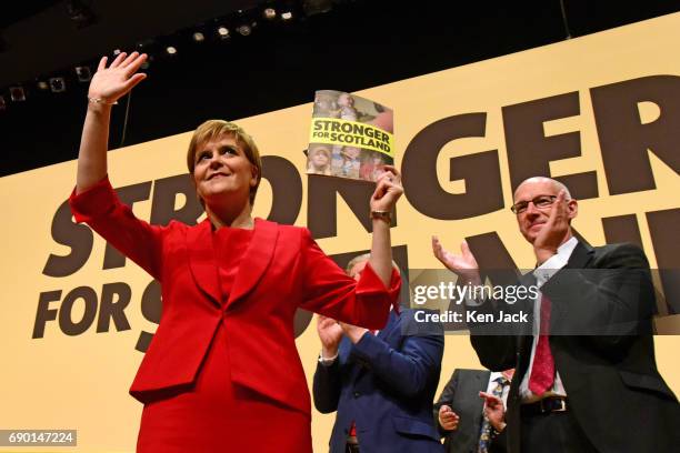 Scotland's First Minister and SNP leader Nicola Sturgeon is applauded by Deputy First Minister John Swinney as she launches the SNP general election...