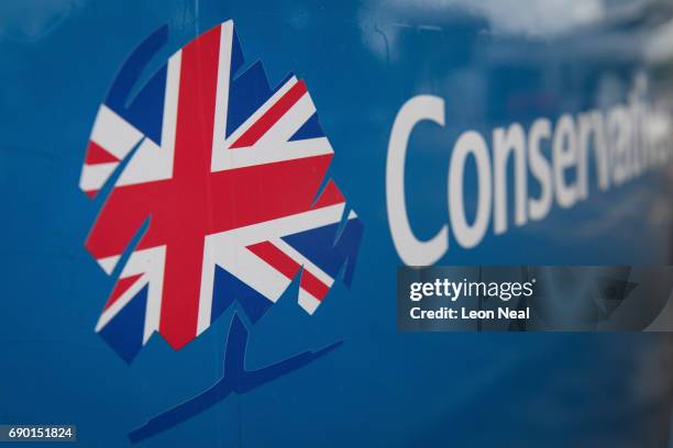 The Conservative party logo is seen on the Conservative election battle bus as it waits in a motorway services car park, ahead of a visit to Simon...