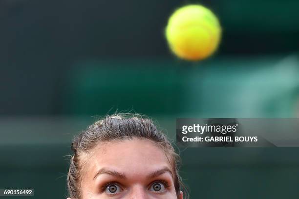 Romania's Simona Halep returns the ball to Slovakia's Jana Cepelova during their tennis match at the Roland Garros 2017 French Open on May 30, 2017...