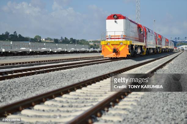 This photo taken on May 30, 2017 shows diesel locomotive train cars at the container terminal of the port of the coastal town of Mombasa. More than a...