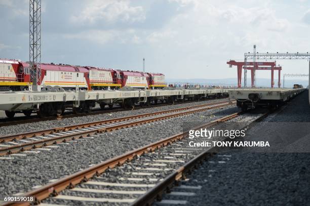 This photo taken on May 30, 2017 shows diesel locomotive train cars at the container terminal of the port of the coastal town of Mombasa. More than a...