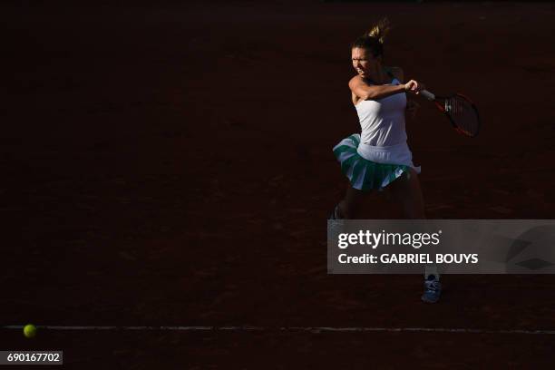 Romania's Simona Halep returns the ball to Slovakia's Jana Cepelova during their tennis match at the Roland Garros 2017 French Open on May 30, 2017...