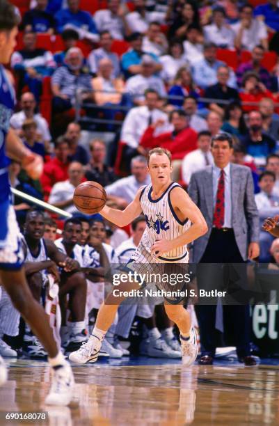 Scott Skiles of the Orlando Magic handles the ball against the Seattle SuperSonics on circa 1993 at Orlando Arena in Orlando, Florida. NOTE TO USER:...