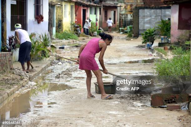 Residents of Rio Formoso municipality clean their houses affected by floods due to heavy rains in Pernambuco state, northeastern Brazil, on May 30,...