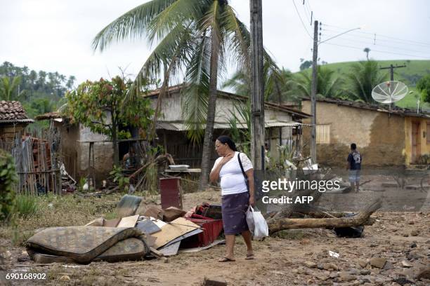 Woman, resident of Rio Formoso municipality stares at the damage caused by floods due to heavy rains in Pernambuco state, northeastern Brazil, on May...