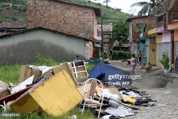 Pile of garbage remains in the street as residents of Rio Formoso municipality clean their homes, after floods due to heavy rains in Pernambuco...