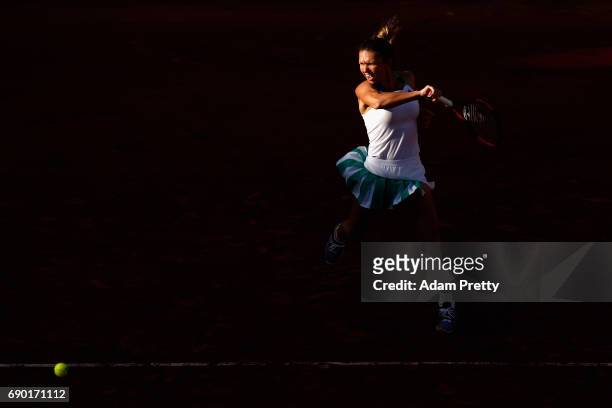 Simona Halep of Romania plays a forehand during the ladies singles first round match against Jana Cepelova of Slovakia on day three of the 2017...