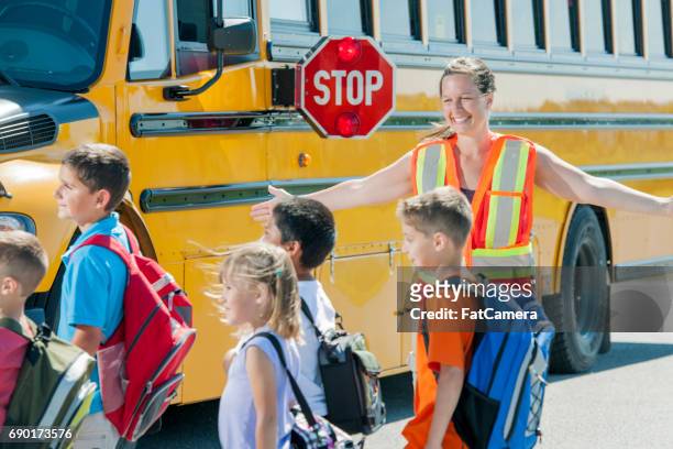crossing the road - community safety stock pictures, royalty-free photos & images