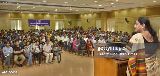 Students and parents attend the Open Day Session for the new academic year 2017-18 at Conference Hall in North Campus on May 30, 2017 in New Delhi,...
