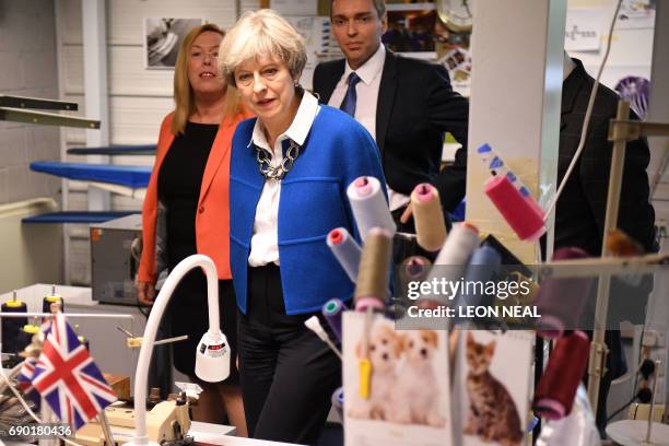 Britain's Prime Minister Theresa May visits Simon Jersey, a business uniform supplier in the constituency of Hyndburn in Accrington, Lancashire...