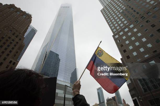 Demonstrator holds a Venezuelan flag during a protest outside of the Goldman Sachs Group Inc. Headquarters in New York, U.S., on Tuesday, May 30,...