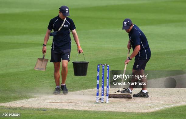 Ground Men clearing the wicket during the ICC Champions Trophy Warm-up match between India and Bangladesh at The Oval in London on May 30, 2017