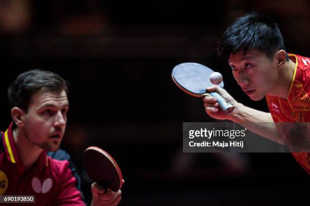 Ma Long of China and Timo Boll of Germany compete during Men Double 1. Round at Table Tennis World Championship at Messe Duesseldorf on May 30, 2017...