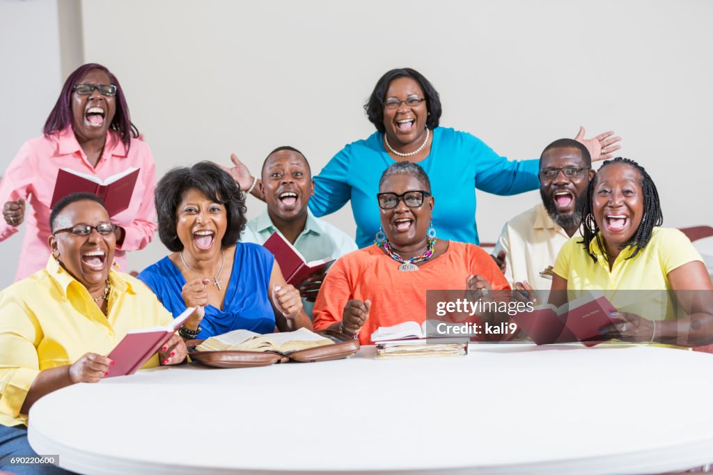 African American men and women at bible study meeting