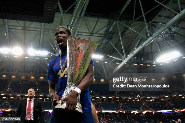 Paul Pogba of Manchester United celebrates with The Europa League trophy after the UEFA Europa League Final between Ajax and Manchester United at...