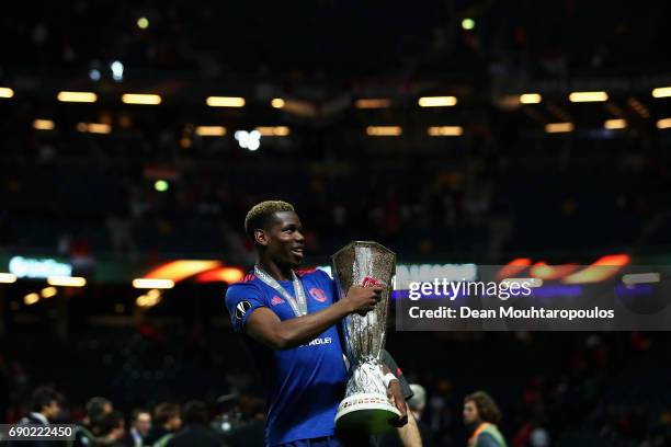 Paul Pogba of Manchester United celebrates with The Europa League trophy after the UEFA Europa League Final between Ajax and Manchester United at...