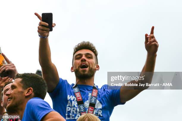 Tommy Smith of Huddersfield Town on the open top bus on May 30, 2017 in Huddersfield, England.