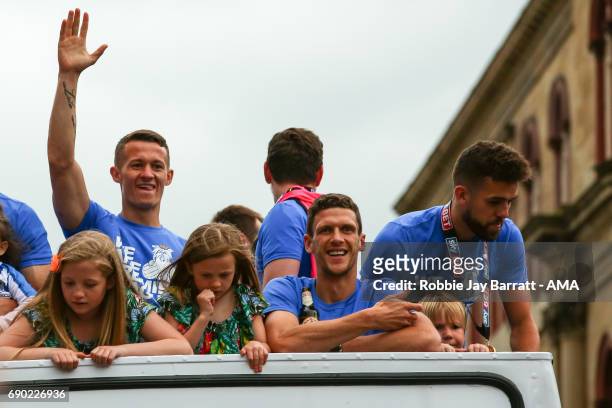 Huddersfield Town players and coaching staff on the open top bus on May 30, 2017 in Huddersfield, England.