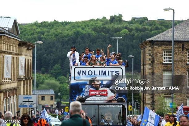 Huddersfield Town players and coaching staff on the open top bus on May 30, 2017 in Huddersfield, England.